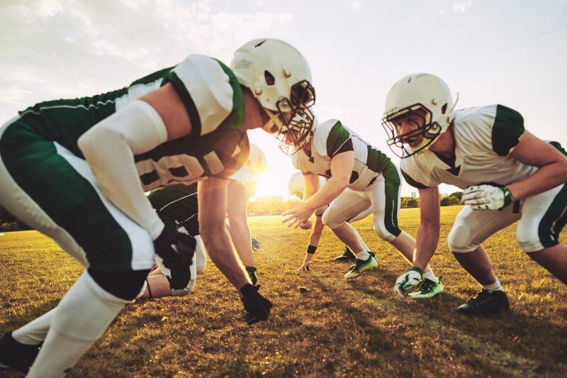 football players huddled in formation