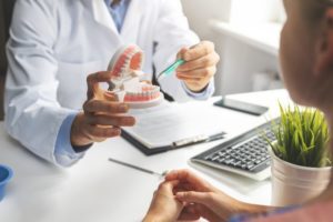 dentist talking to a patient about dentures in Allen 