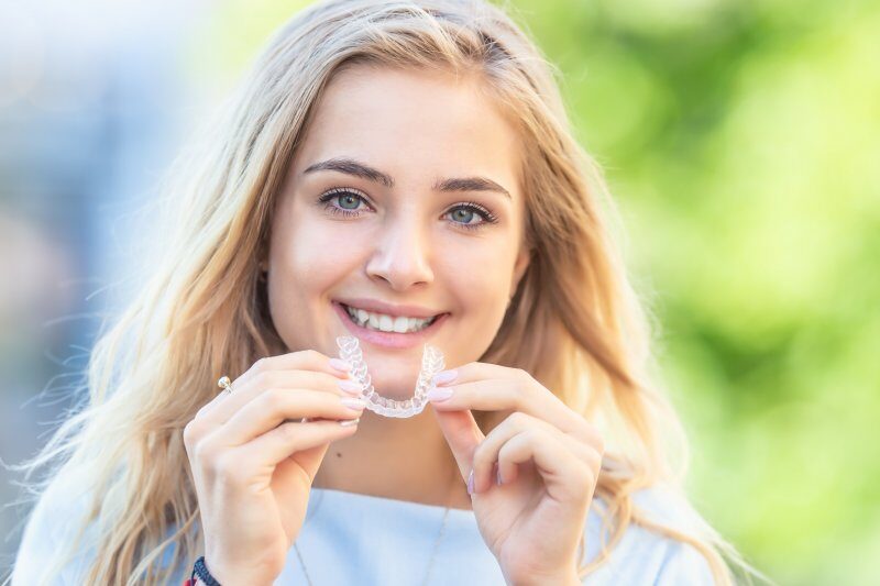 Woman with Invisalign in Allen